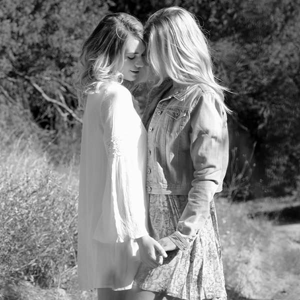 Anna’s touch lingered over the delicate lace and silk, her movements deliberate, drawing a soft, involuntary gasp from Tara.